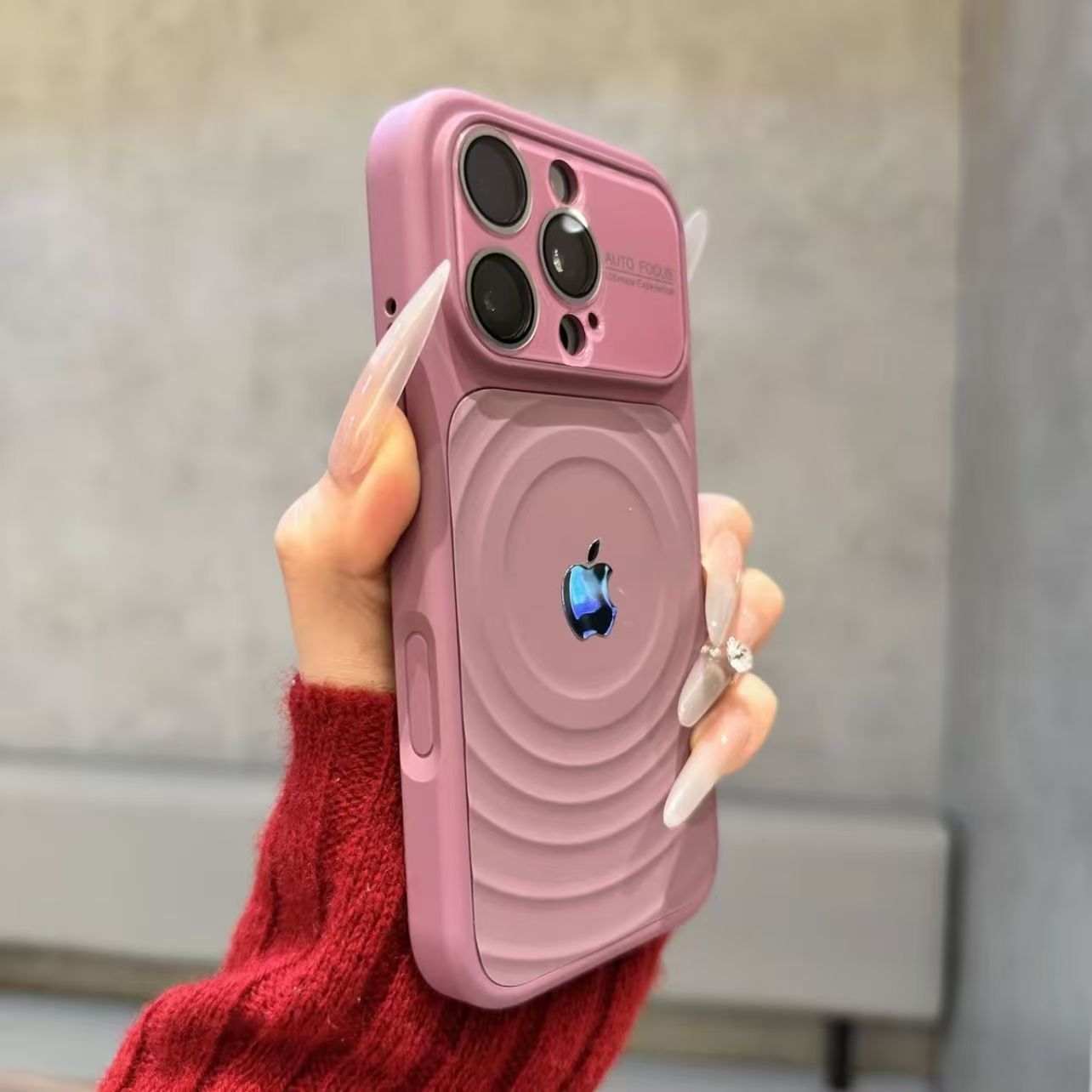 iPhone case with built-in lens protector and wavy texture.