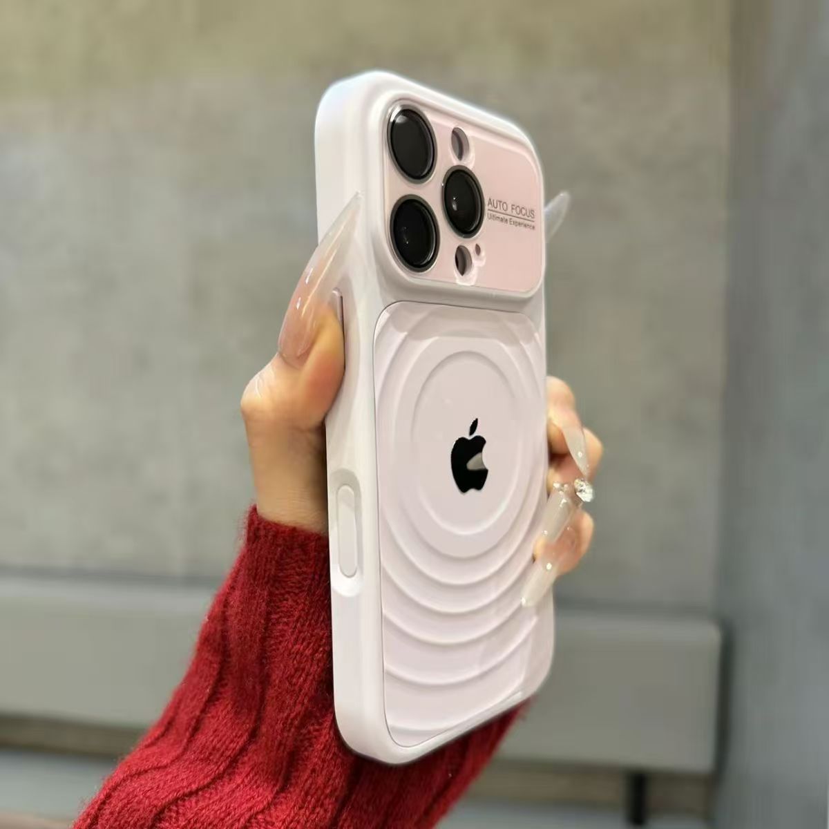 iPhone case with built-in lens protector and wavy texture.