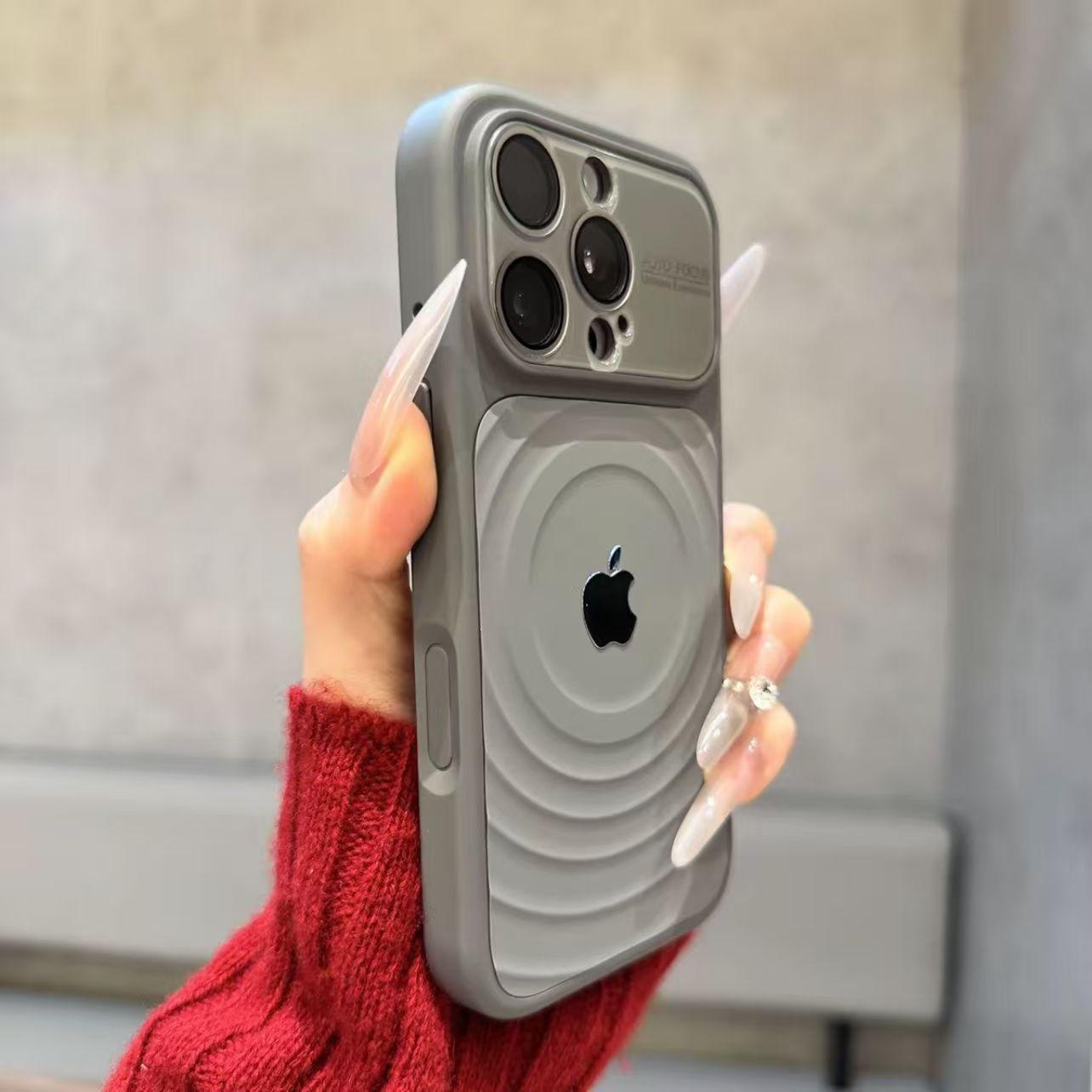 iPhone case with built-in lens protector and wavy texture.