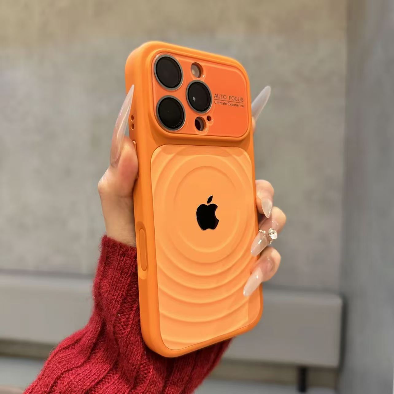 iPhone case with built-in lens protector and wavy texture.