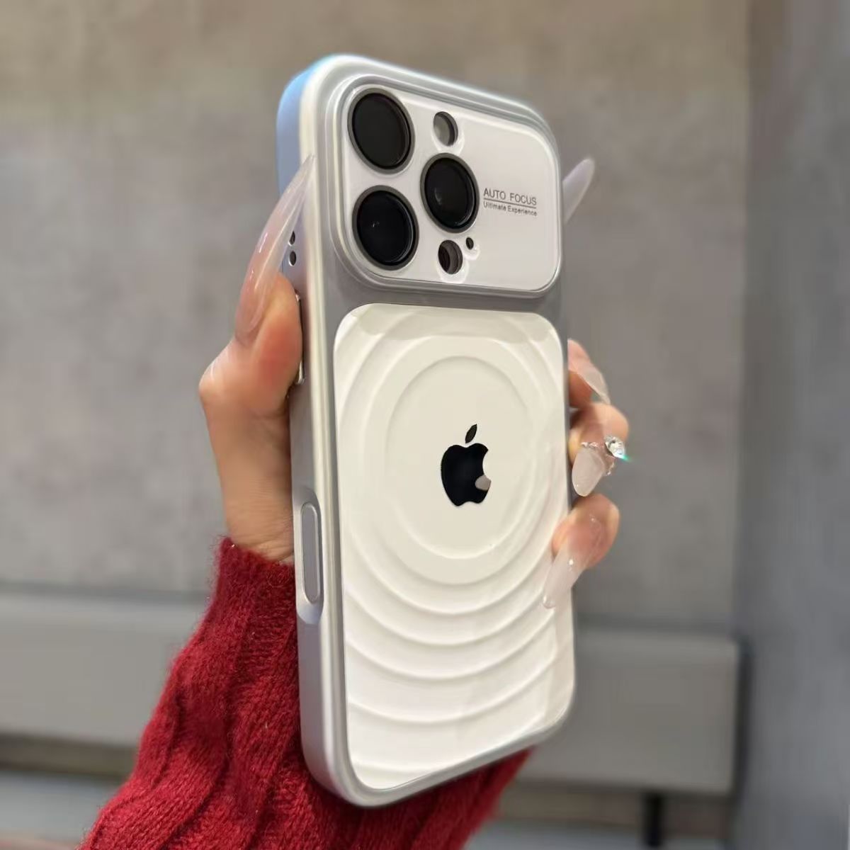 iPhone case with built-in lens protector and wavy texture.
