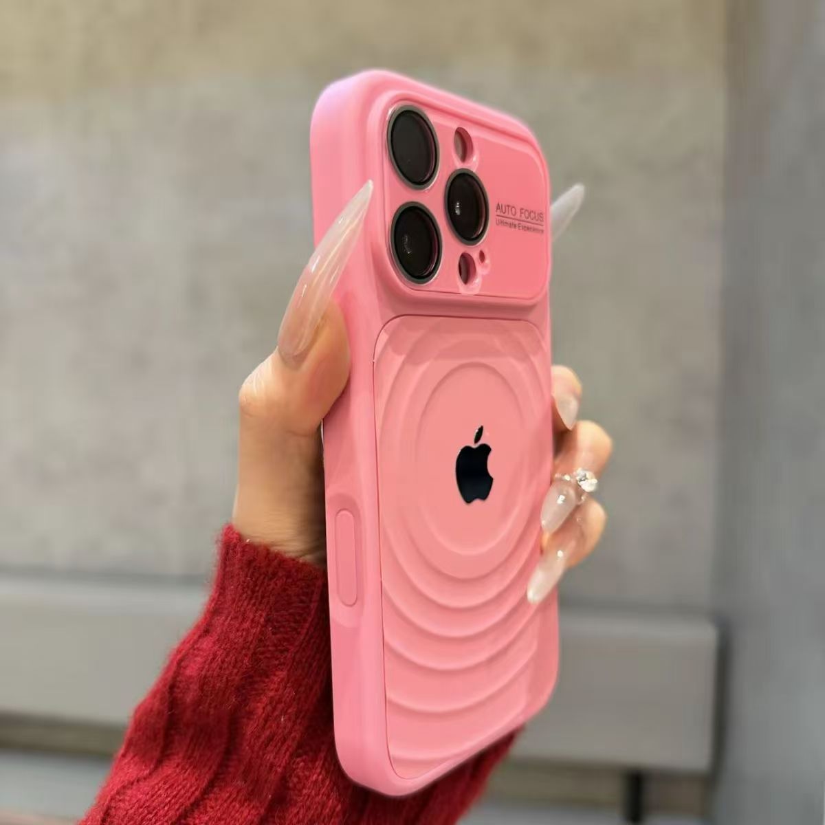 iPhone case with built-in lens protector and wavy texture.